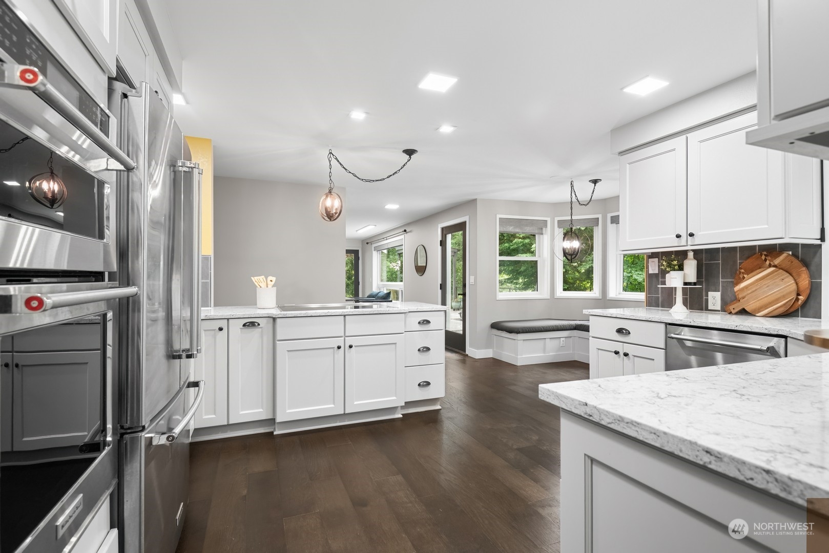 24327 Lockwood Road Bothell, WA 98021 - Photo 10 of 40 a kitchen with a stove a sink a refrigerator and cabinets
