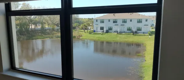 a view of swimming pool from a window
