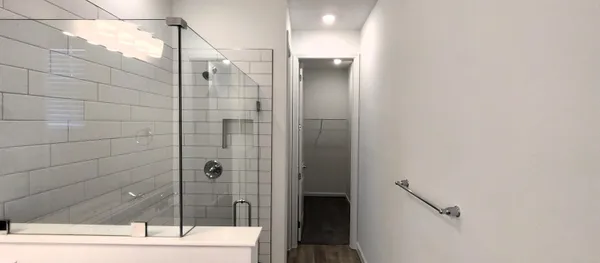 a bathroom with a shower and a sink