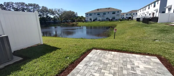 a view of a lake with a yard