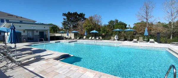 a view of a backyard with sitting area