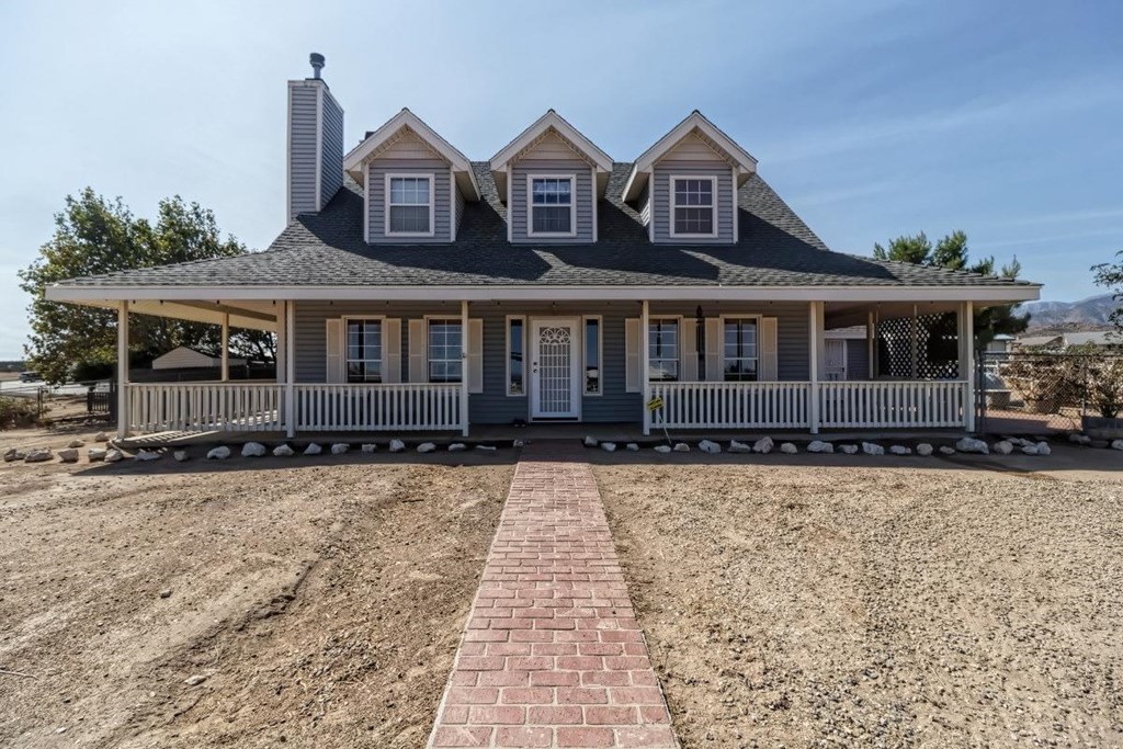 7037 Cygnet Road Phelan, CA 92371 - Photo 1 of 1 front view of a house with a yard