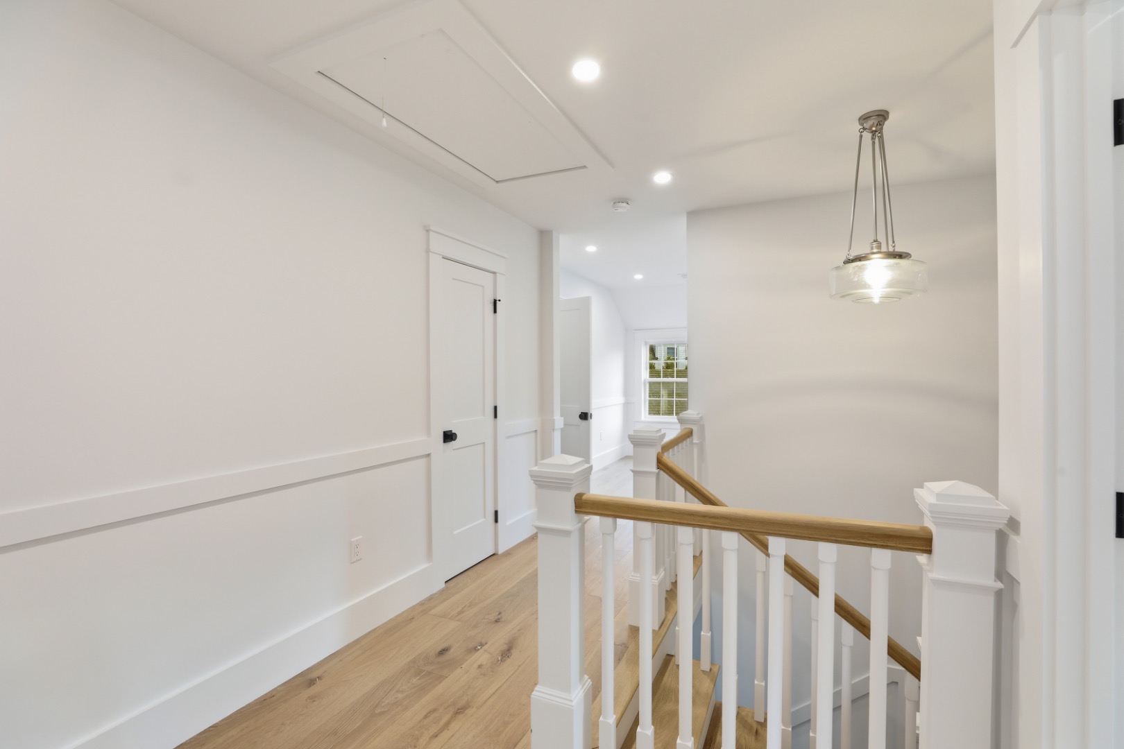 6 Mariner Way Nantucket, MA 02554 - Photo 19 of 31 a view of a hallway with wooden floor and staircase