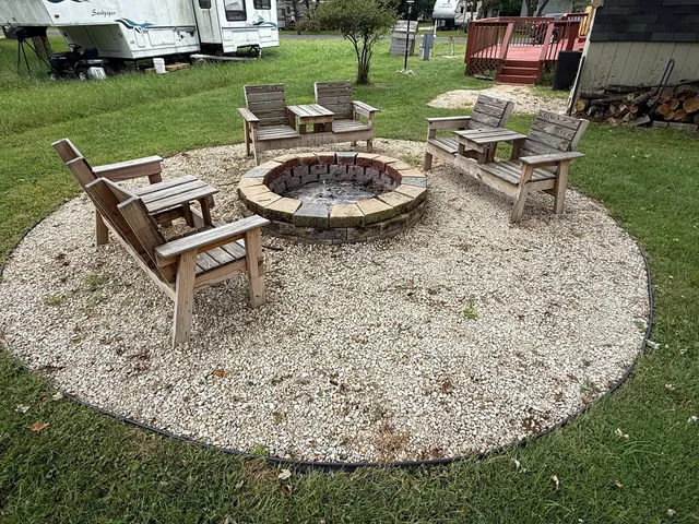 a view of a backyard with sitting area