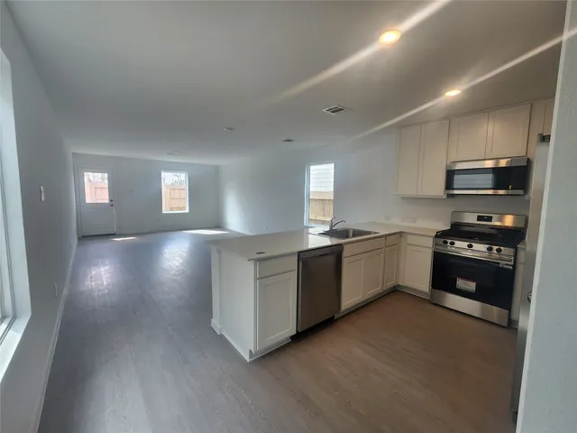 a bathroom with a sink toilet and a mirror