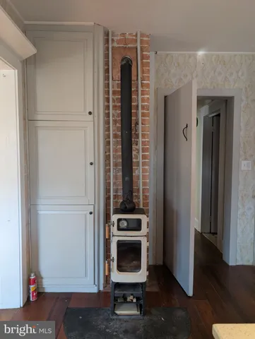 a view of walk in closet with wooden floor