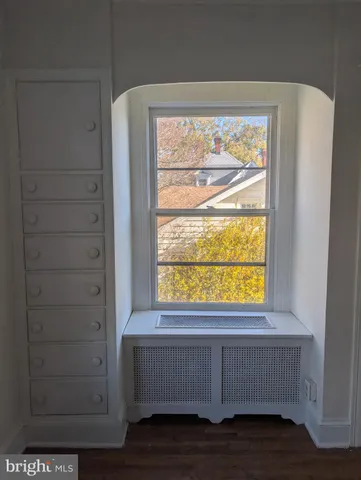 a view of an empty room and window