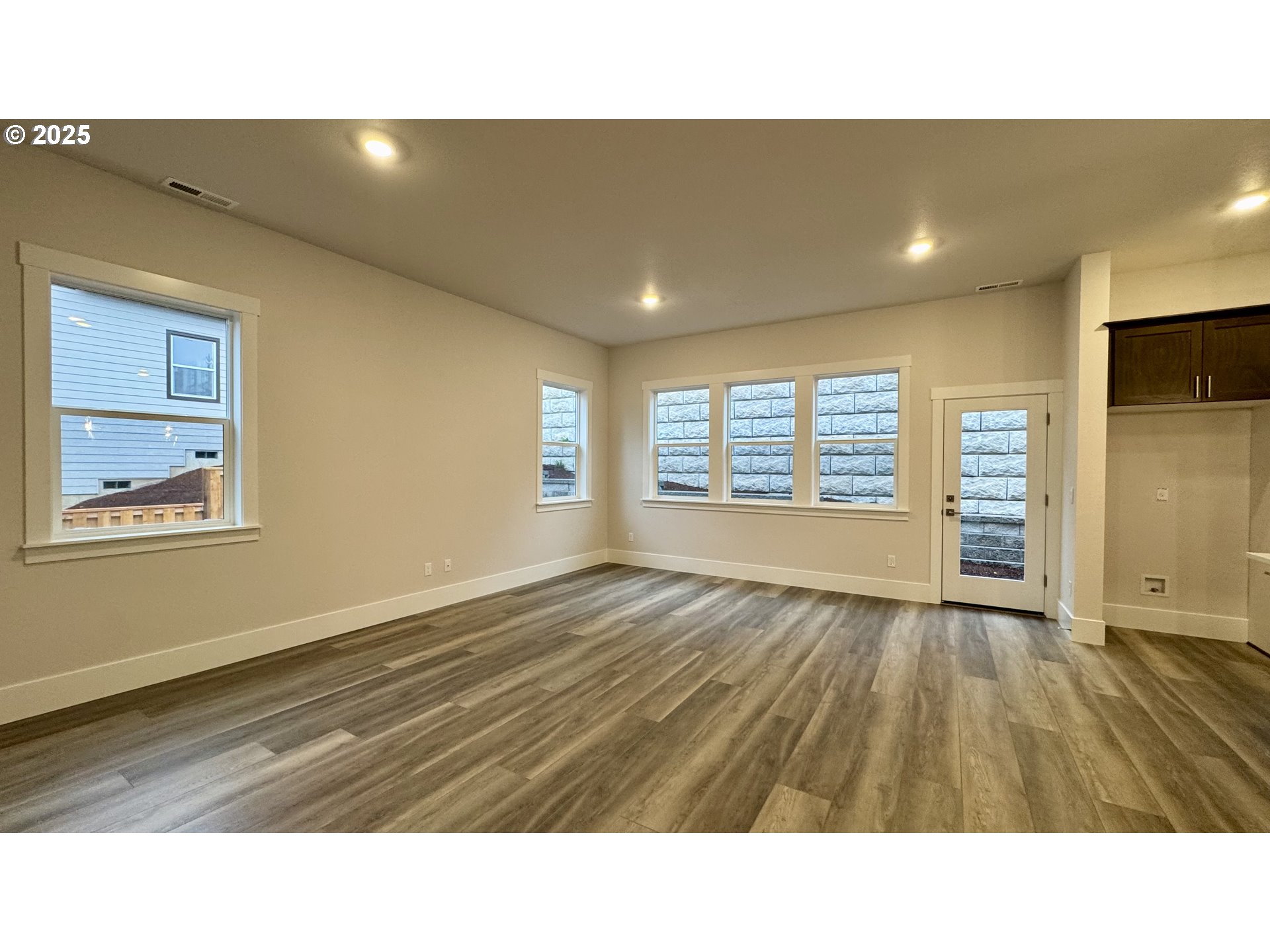 11770 Southwest 176th Drive Beaverton, OR 97007 - Photo 22 of 41 a kitchen with a sink and dishwasher with wooden floor