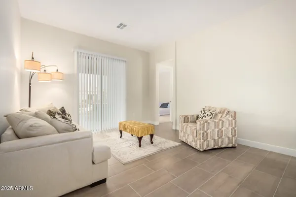a living room with furniture and a window