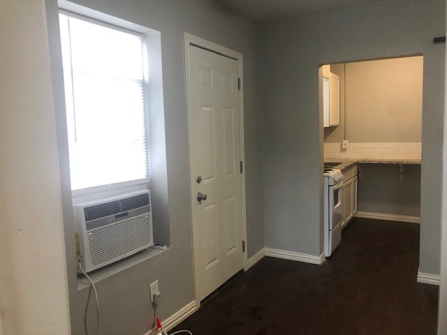 309 Hutcheson Street, Unit 8 Houston, TX 77003 - Photo 10 of 13 a kitchen with a refrigerator and window