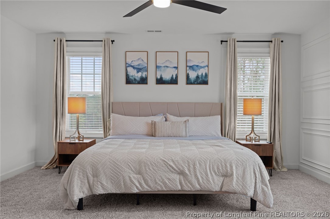 82 Magnolia Grv Way Cameron, NC 28326 - Photo 17 of 20 a bedroom with a large bed and a window