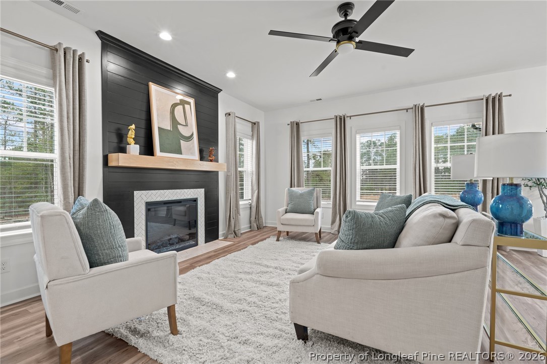 82 Magnolia Grv Way Cameron, NC 28326 - Photo 2 of 20 a living room with furniture and a fireplace