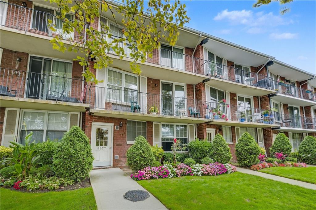9977 Shore Road, Unit 11D Brooklyn, NY 11209 - Photo 1 of 27 front view of a brick building