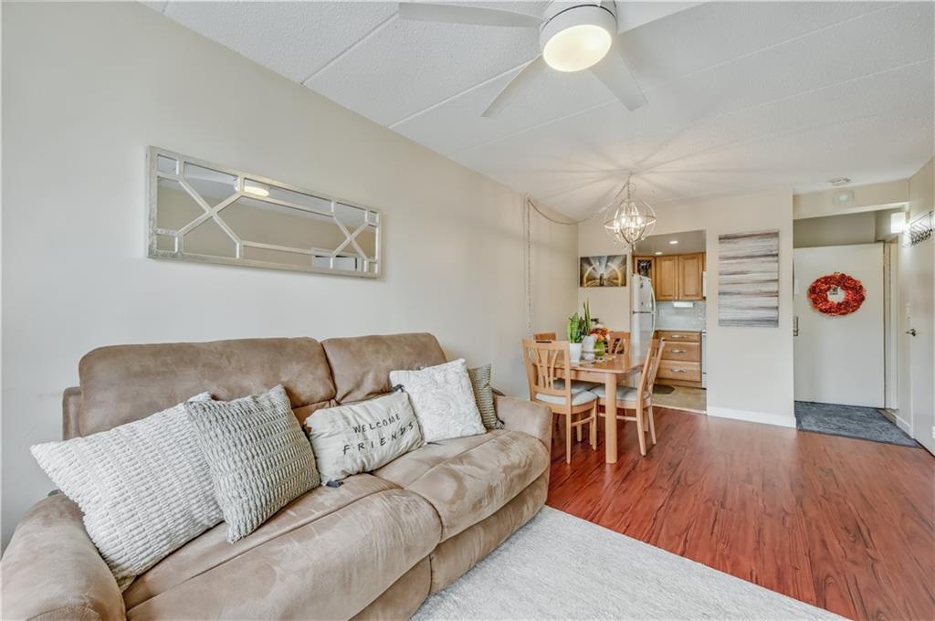 9977 Shore Road, Unit 11D Brooklyn, NY 11209 - Photo 14 of 27 a living room with furniture and wooden floor