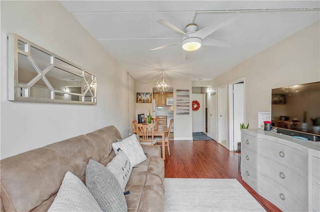 9977 Shore Road, Unit 11D Brooklyn, NY 11209 - Photo 15 of 27 a living room with furniture and a flat screen tv