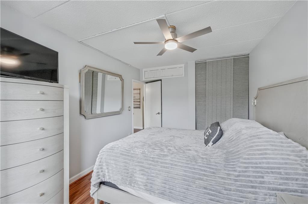 9977 Shore Road, Unit 11D Brooklyn, NY 11209 - Photo 19 of 27 a bedroom with a bed and a flat screen tv