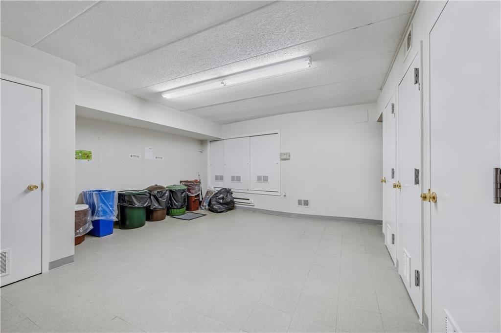 9977 Shore Road, Unit 11D Brooklyn, NY 11209 - Photo 23 of 27 a view of a livingroom with closet and a couch