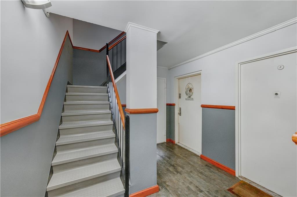9977 Shore Road, Unit 11D Brooklyn, NY 11209 - Photo 24 of 27 a view of entryway with furniture and wooden floor