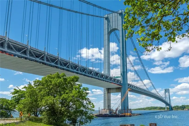 a view of a pathway of a house with a yard