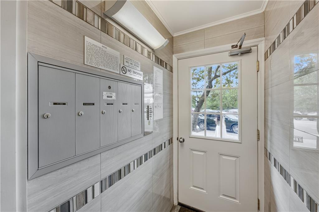 9977 Shore Road, Unit 11D Brooklyn, NY 11209 - Photo 3 of 27 a view of a hallway with windows