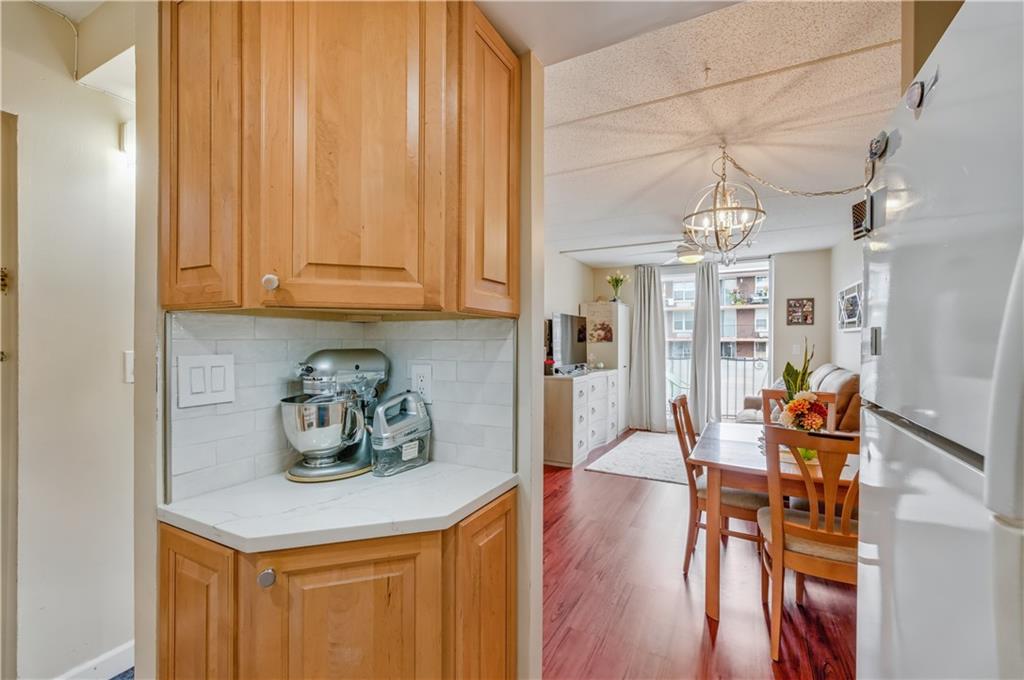 9977 Shore Road, Unit 11D Brooklyn, NY 11209 - Photo 7 of 27 a view of dining room and wooden floor