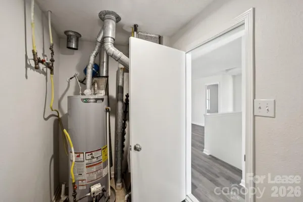a view of an entryway with wooden floor