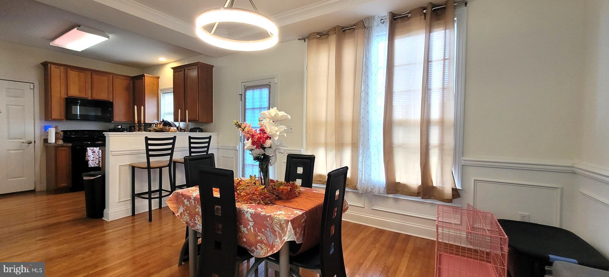 74 Redstone Court Felton, DE 19943 - Photo 11 of 33 a view of a dining room with furniture window and wooden floor