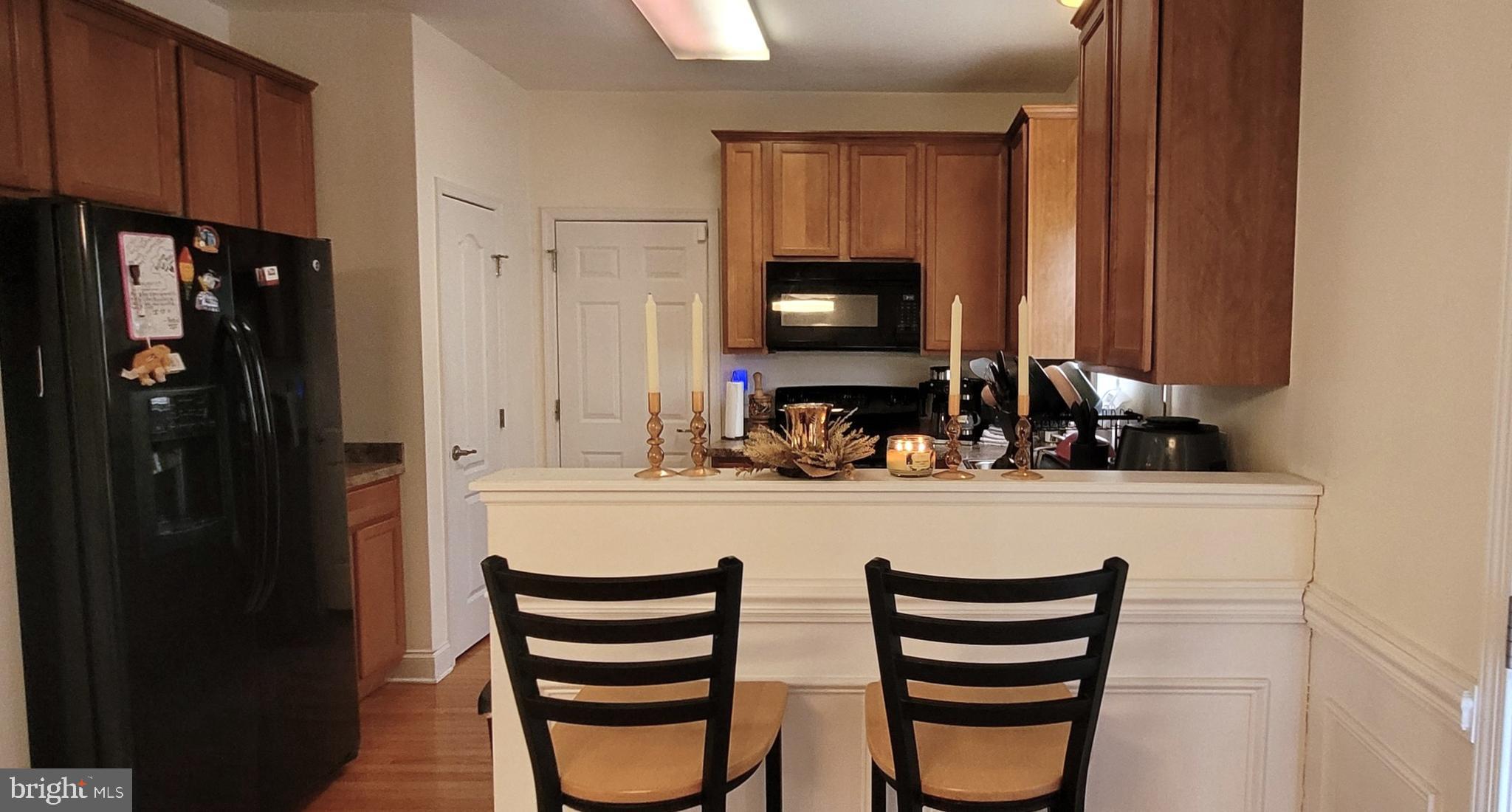 74 Redstone Court Felton, DE 19943 - Photo 12 of 33 a kitchen with a refrigerator and a sink