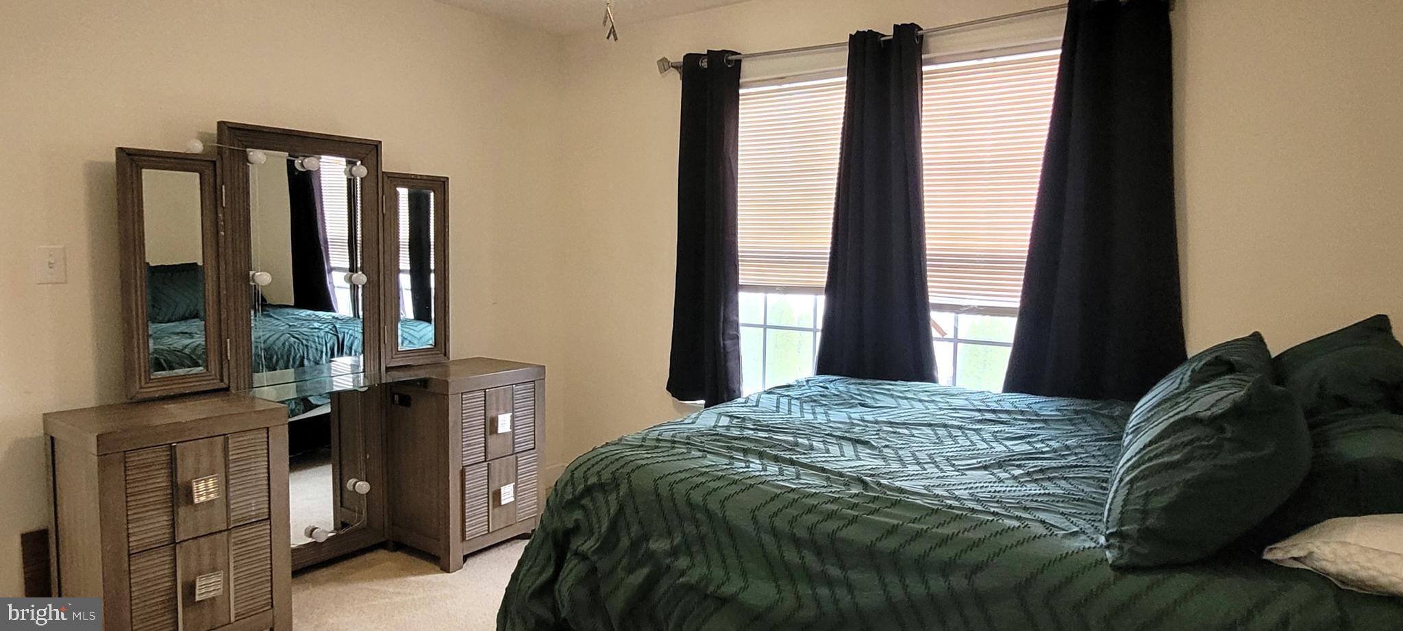 74 Redstone Court Felton, DE 19943 - Photo 20 of 33 a bedroom with a bed window and mirror