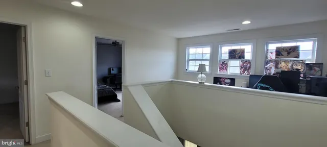 a living room with furniture and natural light