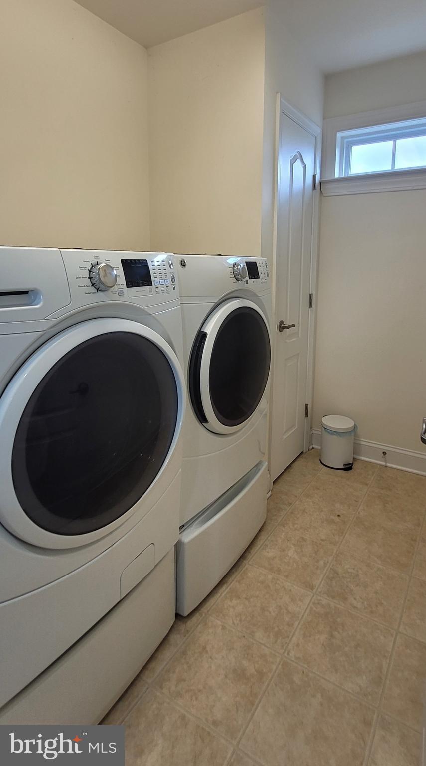 74 Redstone Court Felton, DE 19943 - Photo 28 of 33 a utility room with dryer and washer