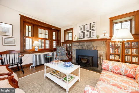 a living room with furniture fireplace and flat screen tv