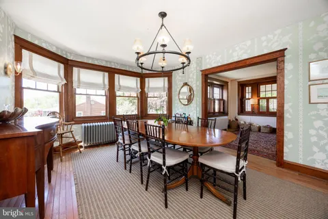 a dining room with furniture window wooden floor