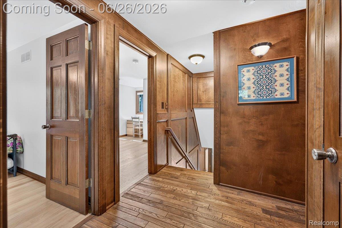 29498 East River Road Grosse Ile, MI 48138 - Photo 28 of 66 Wood Paneled Hallway on Second Floor