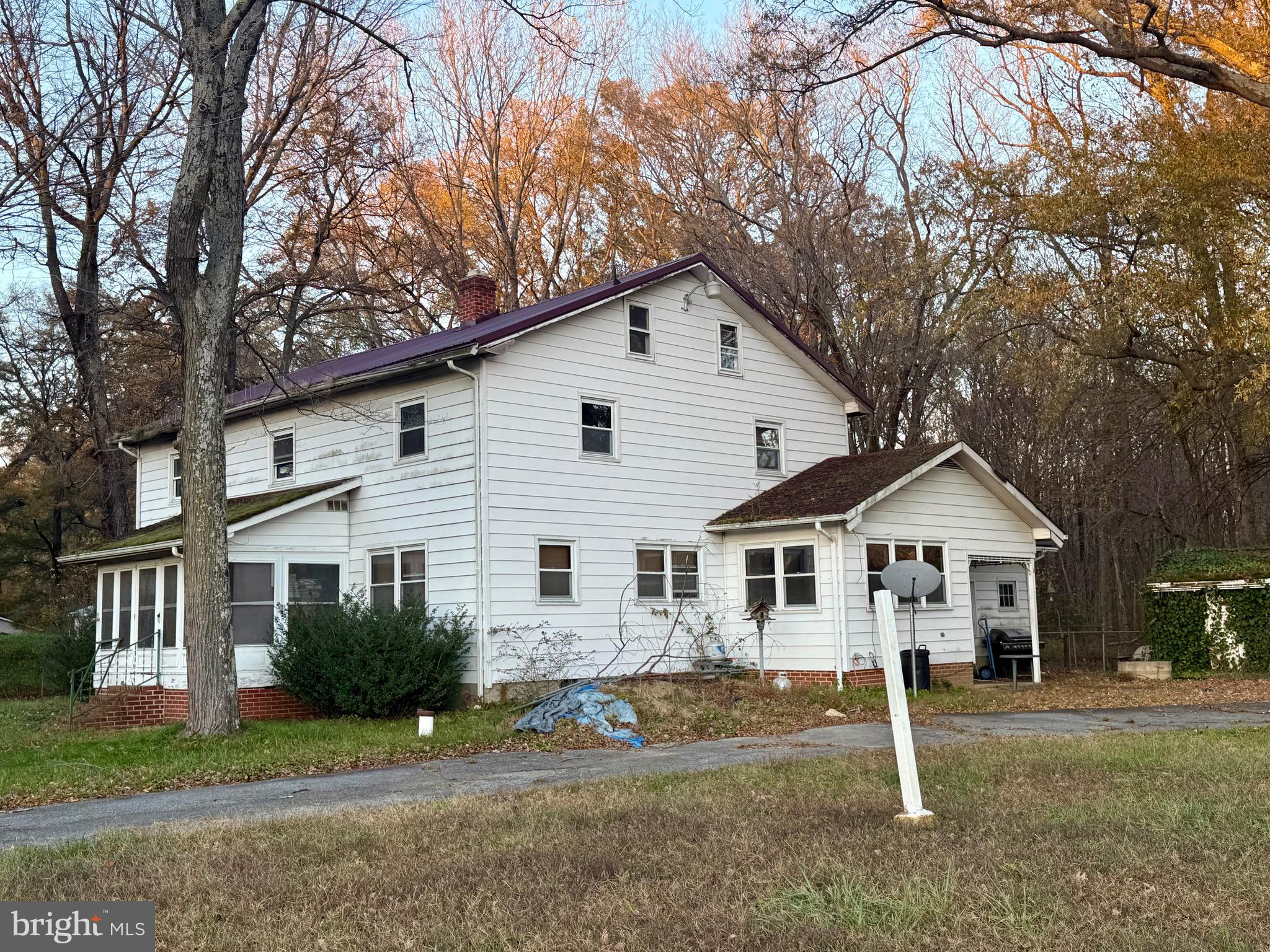 1212 Pearsons Corner Road Hartly, DE 19953 - Photo 3 of 6 a front view of a house with a yard