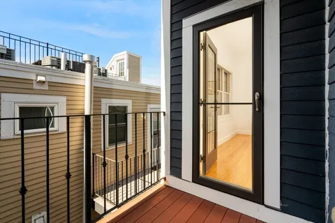 a view of a balcony with a door