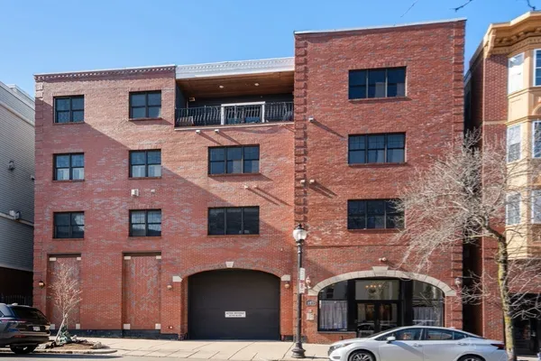 a front view of a building with glass windows