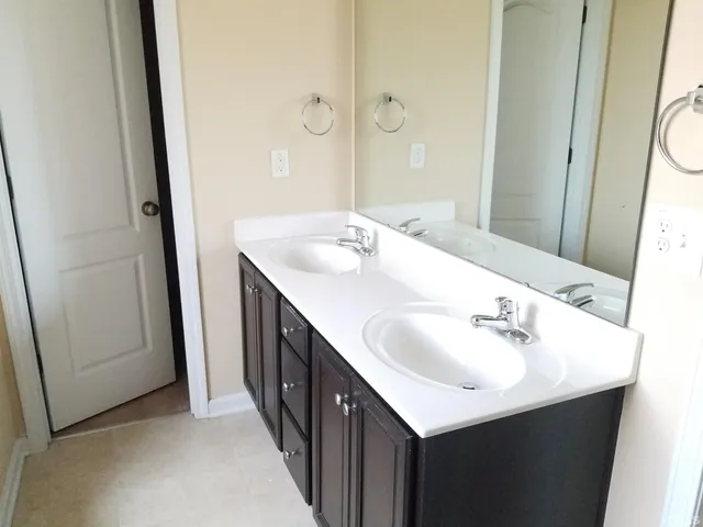 a bathroom with a tub and shower