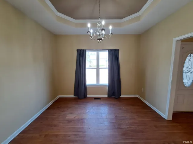 a view of livingroom with window and hardwood floor
