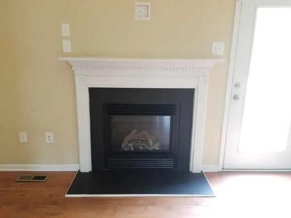 a living room with a fireplace