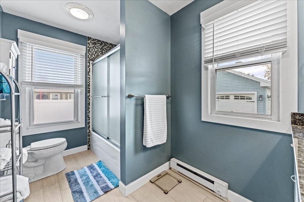 11 Mary Street Springfield, MA 01118 - Photo 11 of 42 a bathroom with a toilet sink and mirror