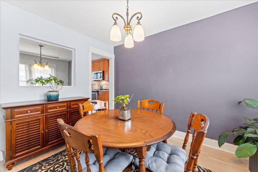 11 Mary Street Springfield, MA 01118 - Photo 15 of 42 a dining room with furniture and wooden floor