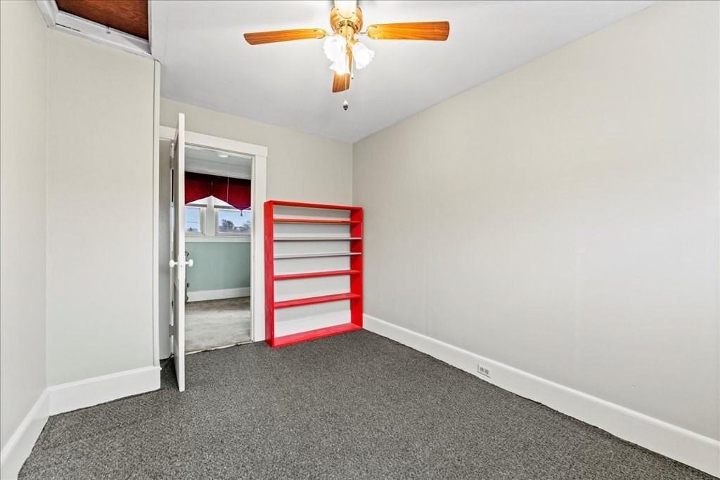11 Mary Street Springfield, MA 01118 - Photo 33 of 42 a room with white walls and ceiling fan