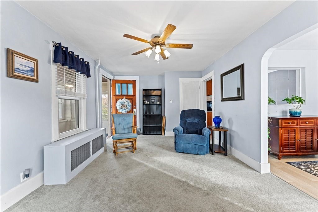 11 Mary Street Springfield, MA 01118 - Photo 5 of 42 a living room with furniture a chandelier fan and a window