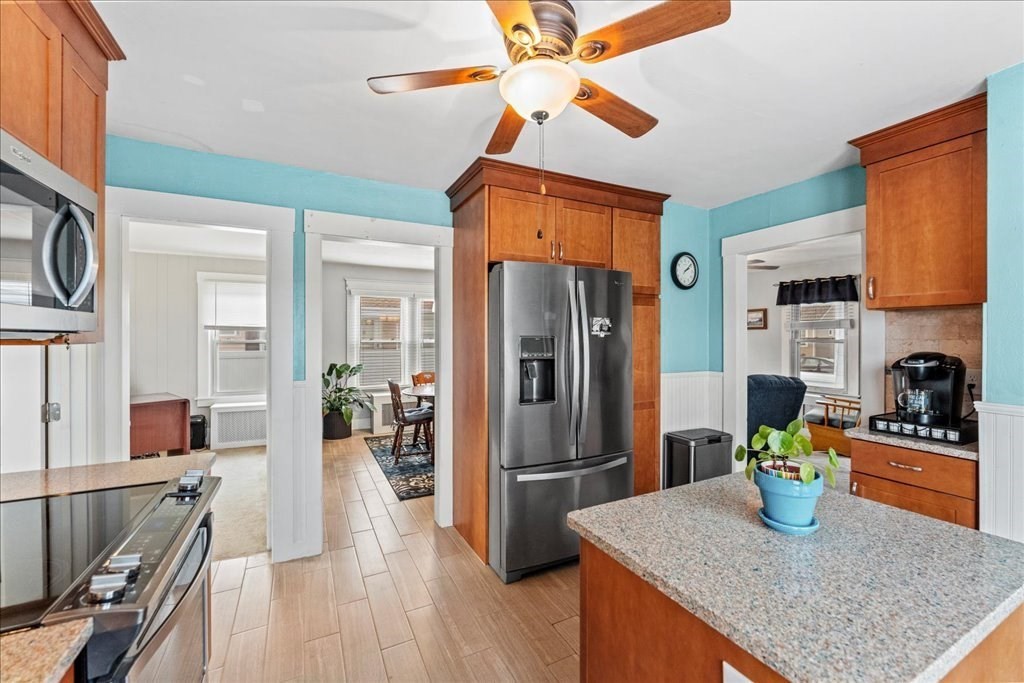 11 Mary Street Springfield, MA 01118 - Photo 7 of 42 a kitchen with stainless steel appliances granite countertop a refrigerator a stove and a sink