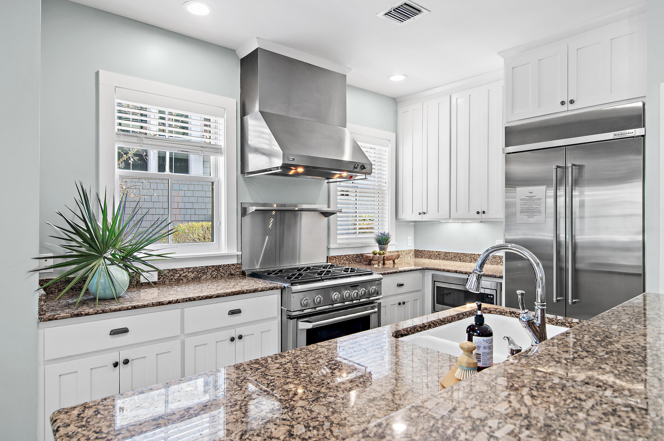 220 Salt Lane Inlet Beach, FL 32461 - Photo 12 of 39 a kitchen with granite countertop a stove a sink and a refrigerator