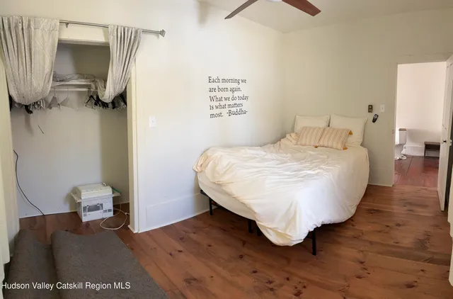 a bedroom with a bed and a table in it