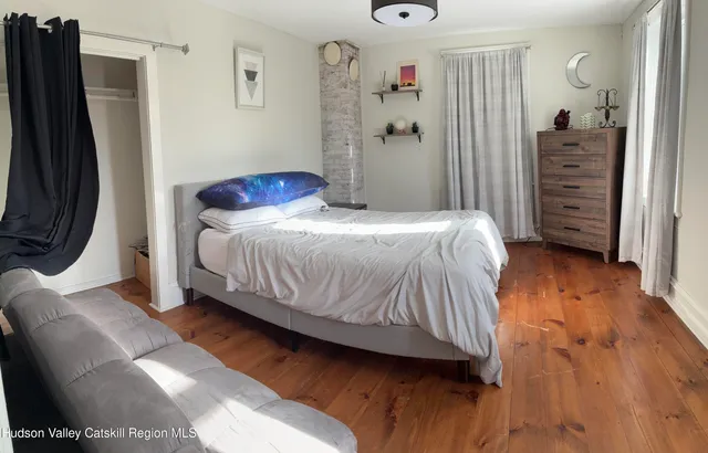 a bedroom with a bed and a closet