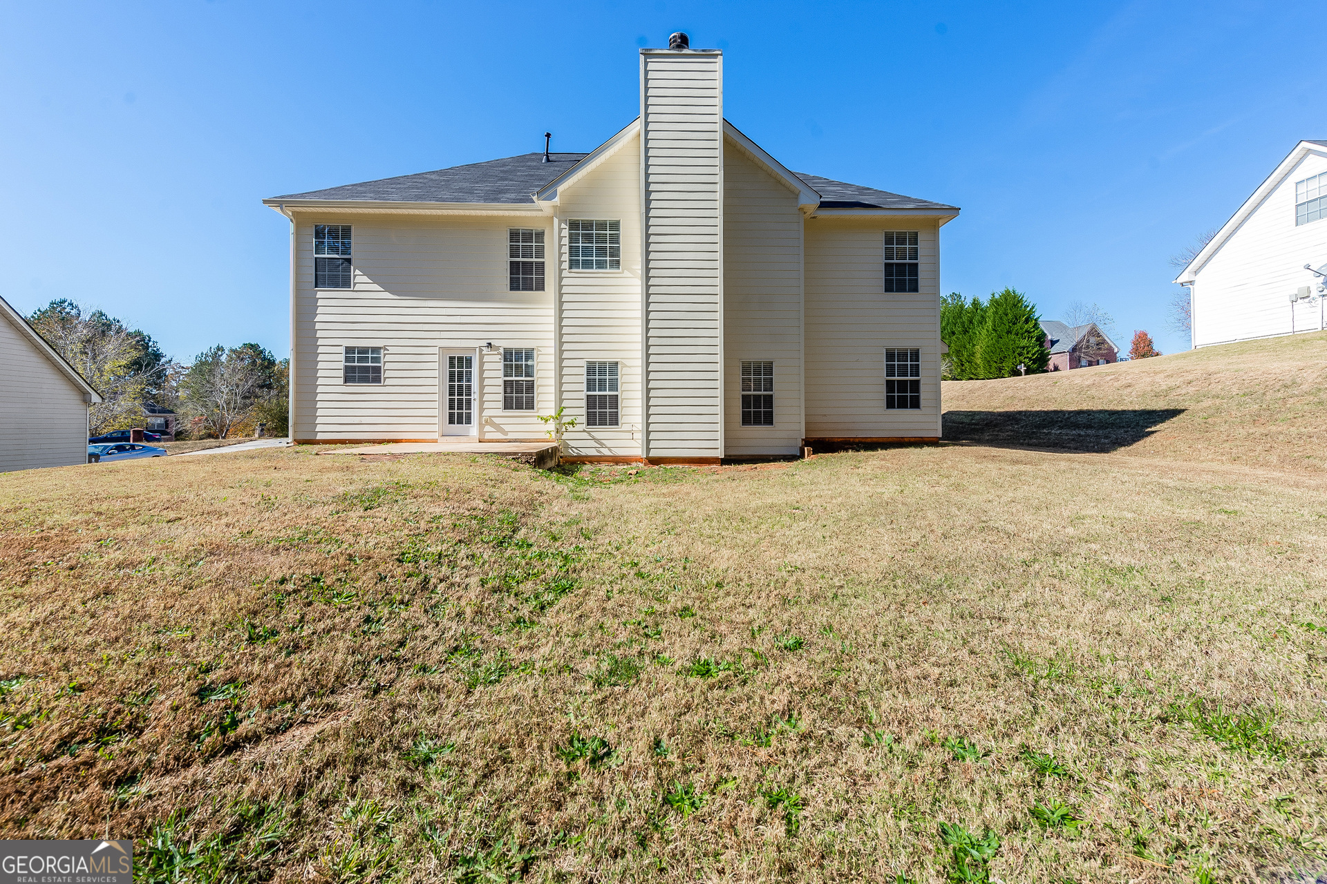 231 Biltmore Way Stockbridge, GA 30281 - Photo 4 of 15 a front view of a house with a yard