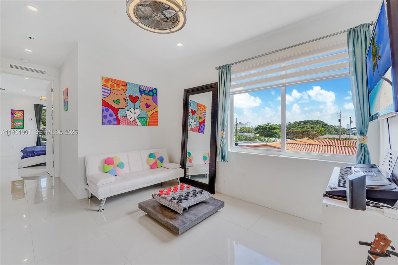 2943 Southwest 23rd Street Miami, FL 33145 - Photo 13 of 21 a living room with furniture and a large window